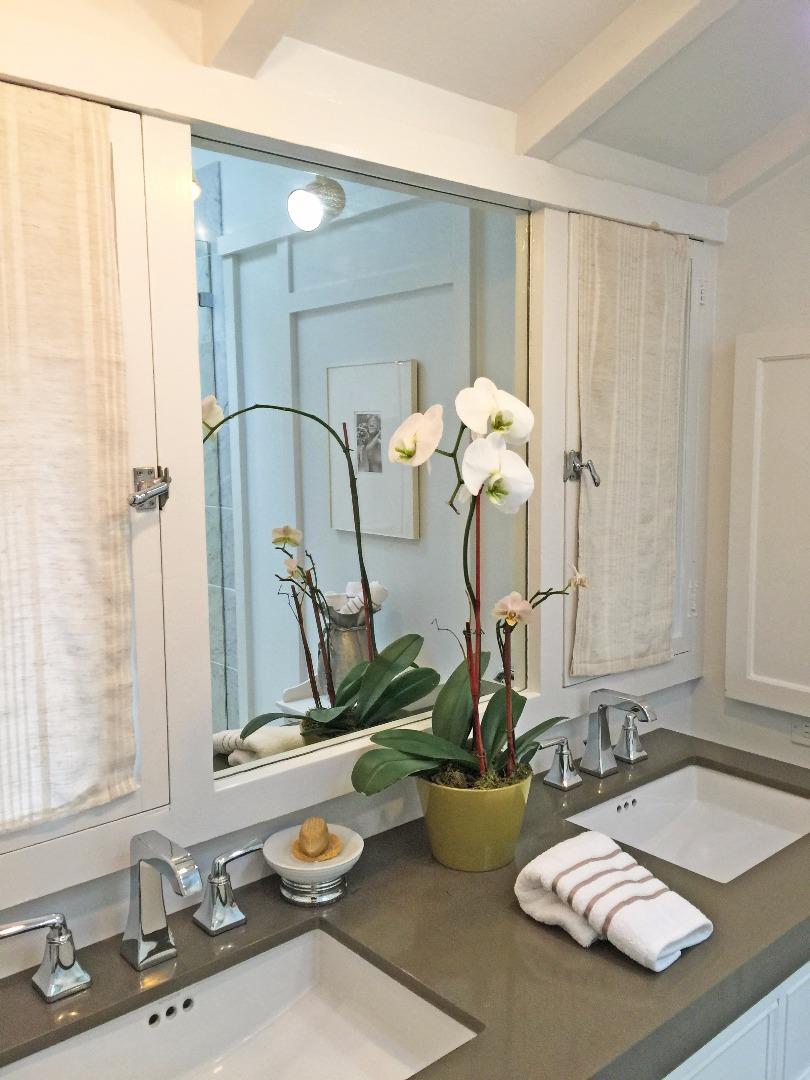 0 Camino Real Carmel, CA 93921 - Photo 20 of 27 a bathroom with double vanity sinks and a mirror