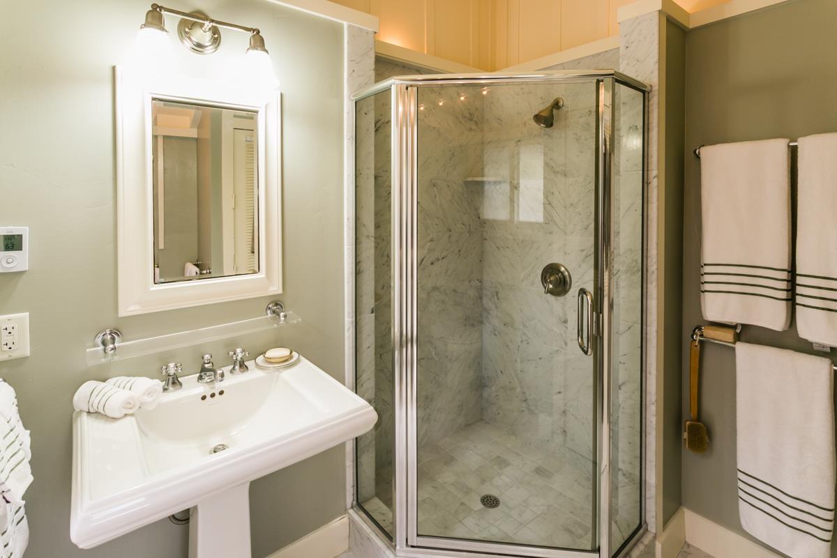 0 Camino Real Carmel, CA 93921 - Photo 23 of 27 a bathroom with a shower a sink and a mirror