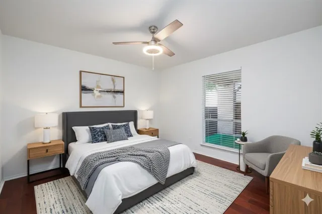 a bedroom with bed and a window