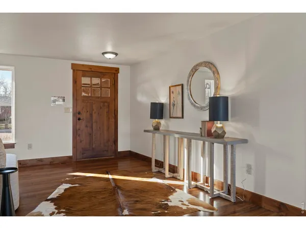 a view of a livingroom with wooden floor