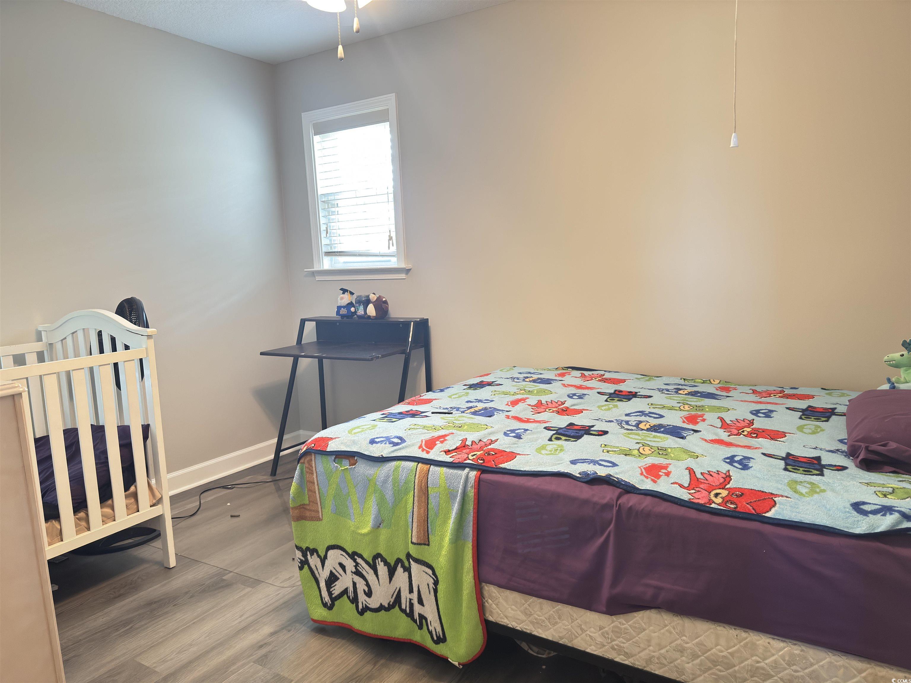 788 Rambler Court Myrtle Beach, SC 29588 - Photo 3 of 17 Bedroom with wood finished floors and baseboards