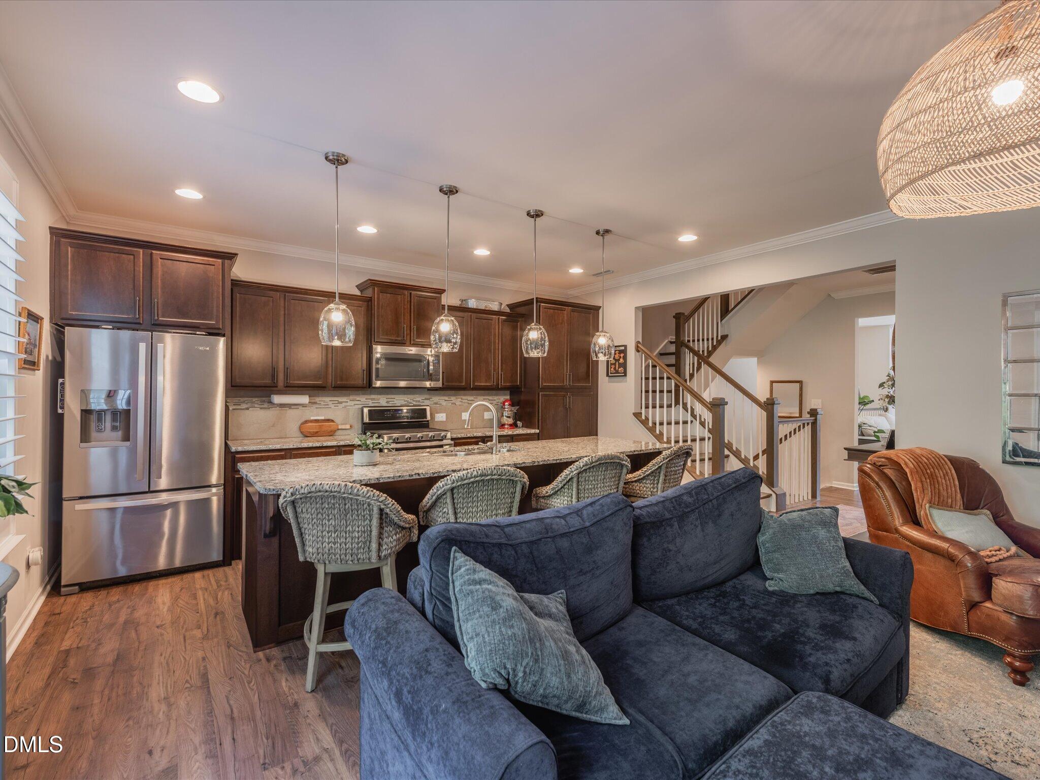 533 Metro Station Apex, NC 27502 - Photo 10 of 45 a living room with furniture and kitchen view