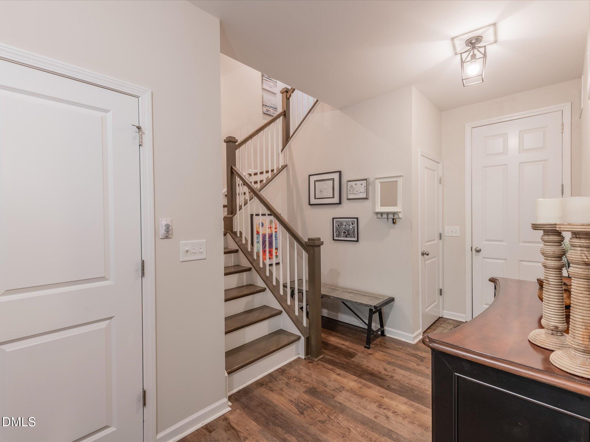 533 Metro Station Apex, NC 27502 - Photo 18 of 45 a view of entryway and hall with wooden floor