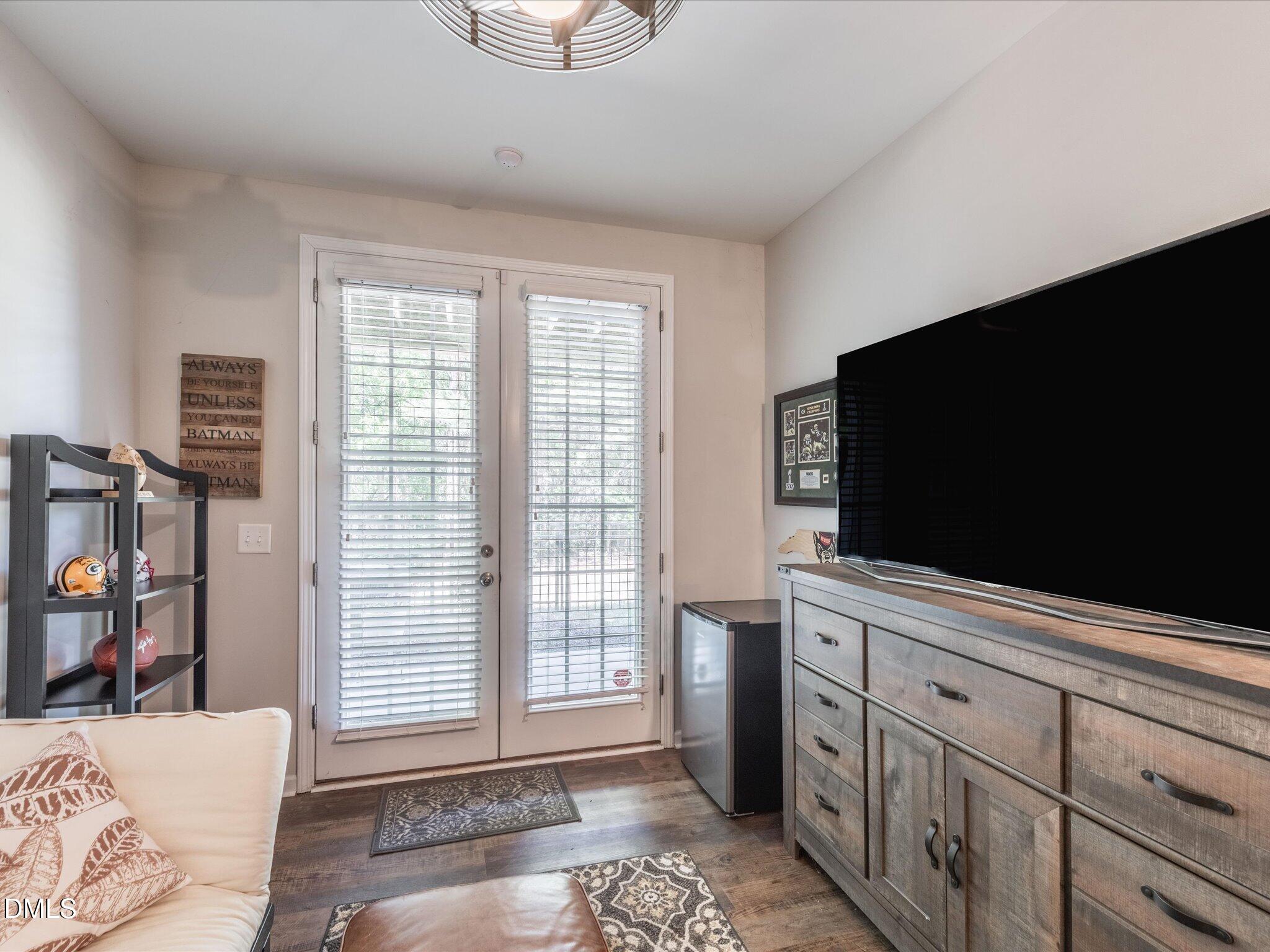 533 Metro Station Apex, NC 27502 - Photo 21 of 45 a living room with furniture and a flat screen tv