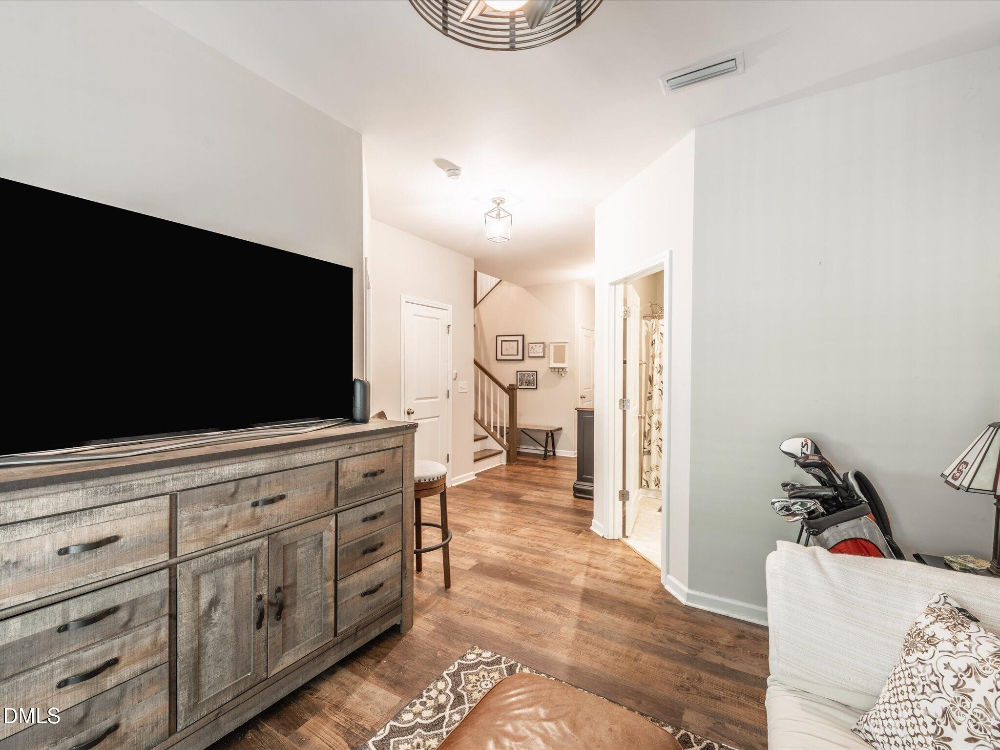 533 Metro Station Apex, NC 27502 - Photo 22 of 45 a living room with furniture and a flat screen tv