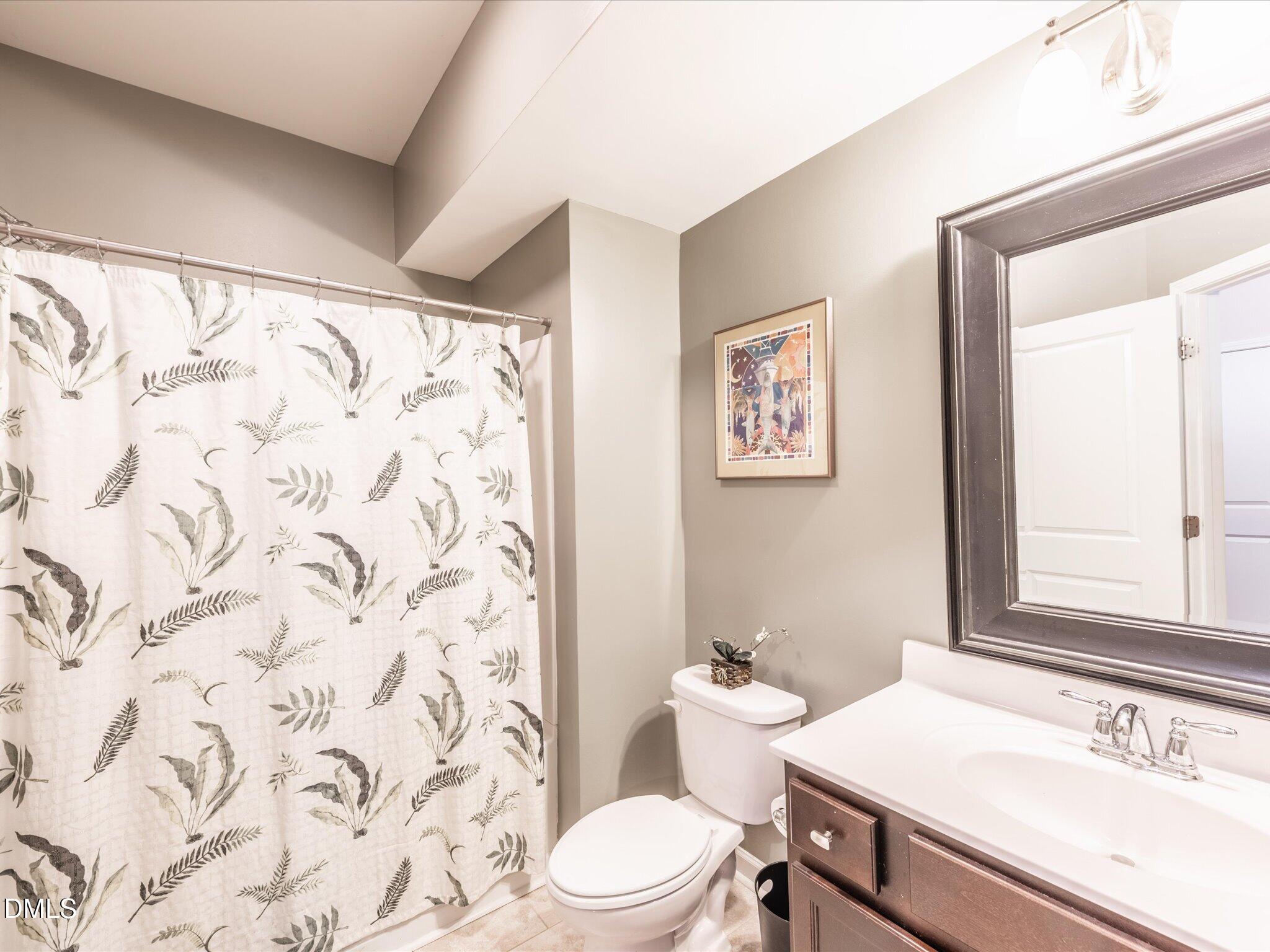 533 Metro Station Apex, NC 27502 - Photo 23 of 45 a bathroom with a sink and a mirror