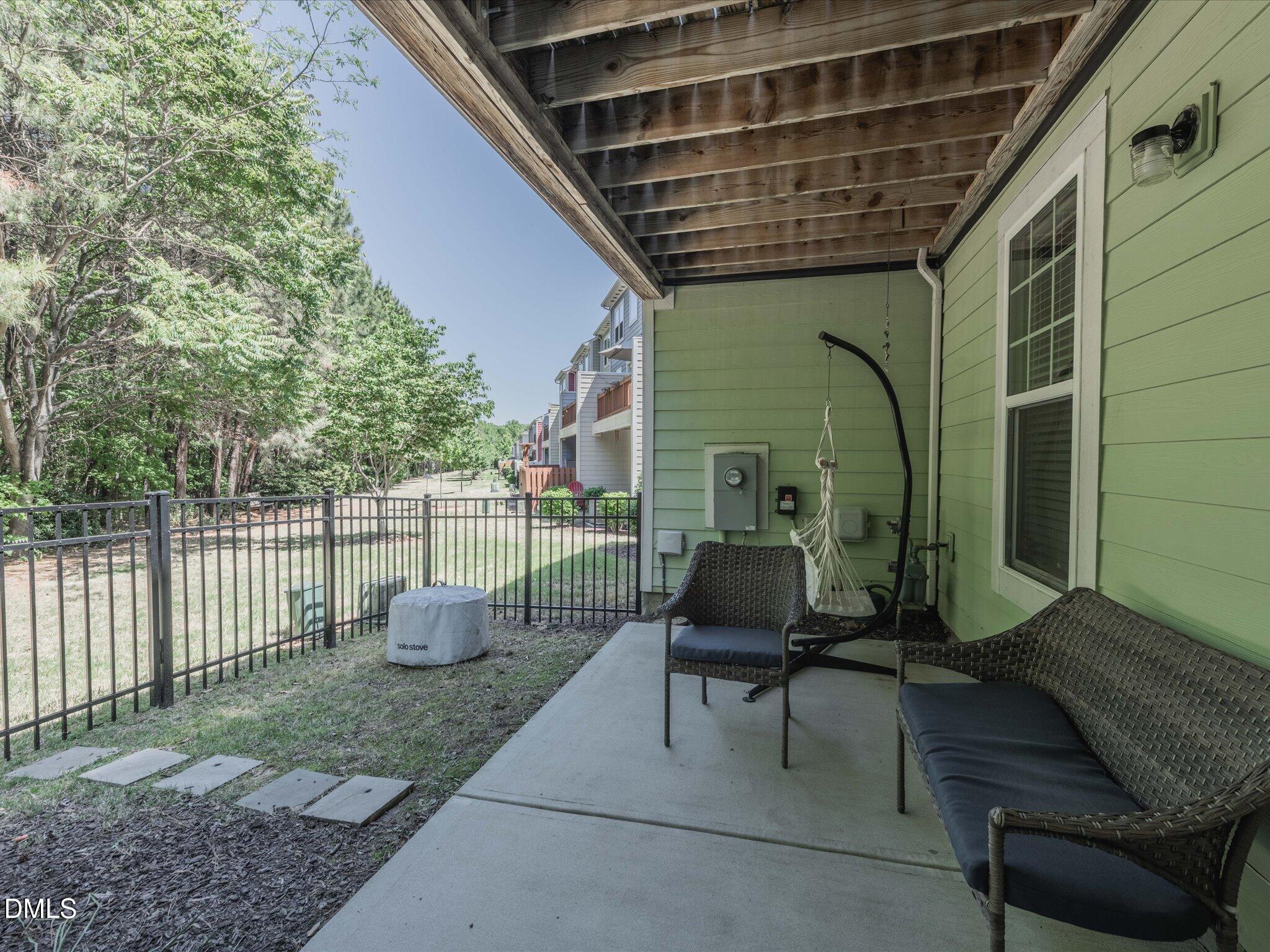 533 Metro Station Apex, NC 27502 - Photo 26 of 45 a view of a porch with furniture and a backyard