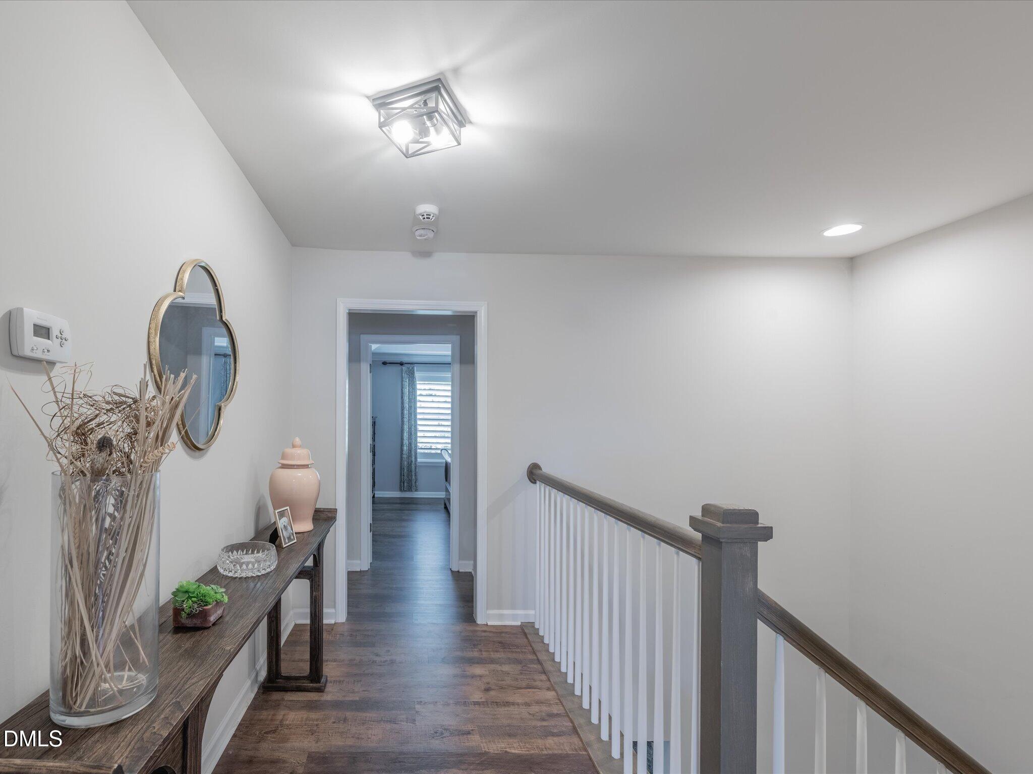 533 Metro Station Apex, NC 27502 - Photo 28 of 45 a view of a hallway to a livingroom with furniture