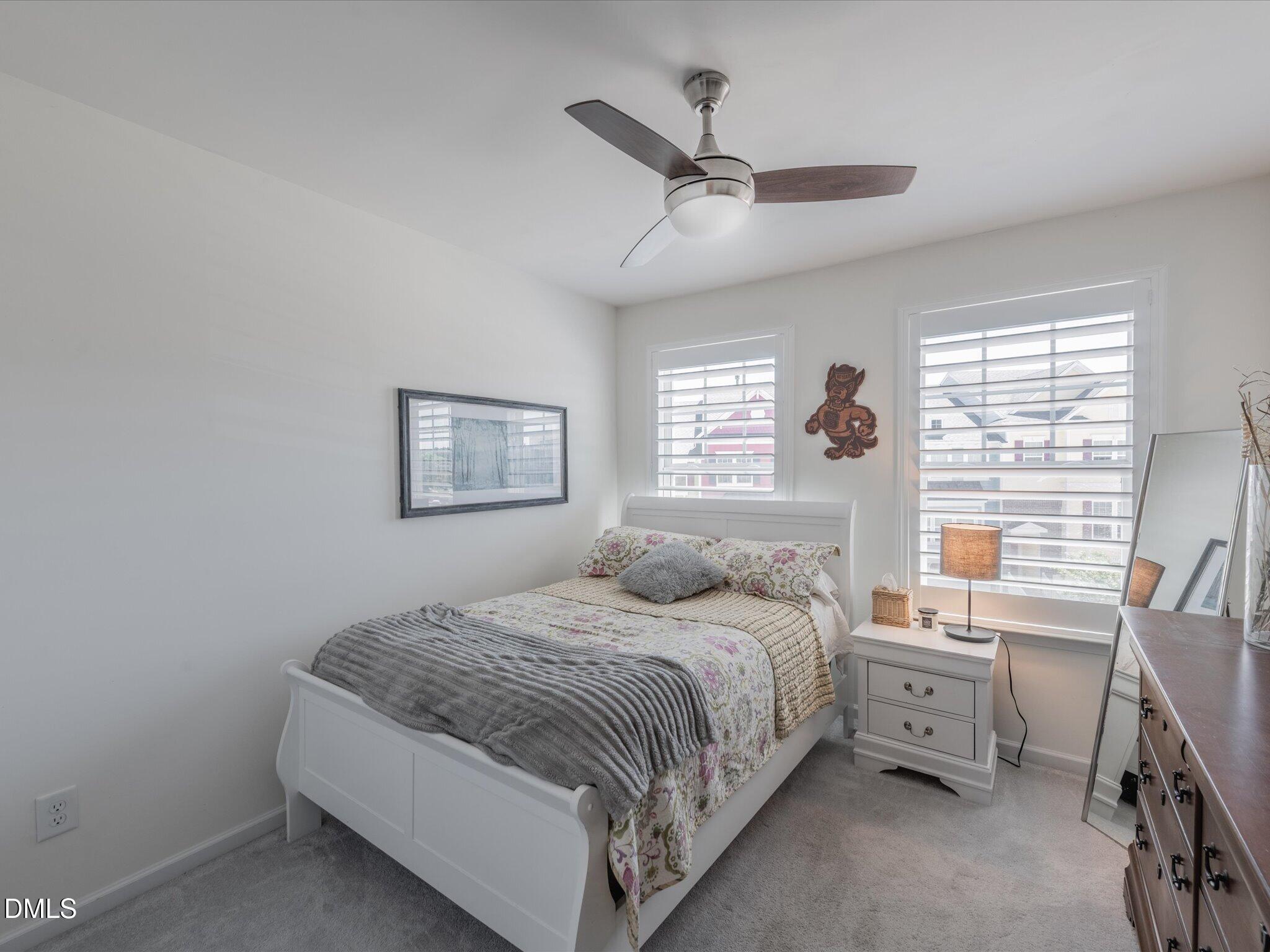 533 Metro Station Apex, NC 27502 - Photo 29 of 45 a bedroom with a bed and a window