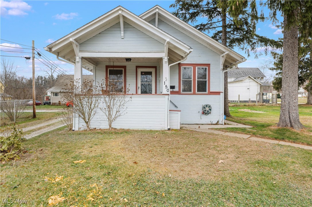 150 Diagonal Street Rittman, OH 44270 - Photo 1 of 21 Bungalow-style home featuring covered porch and a front lawn