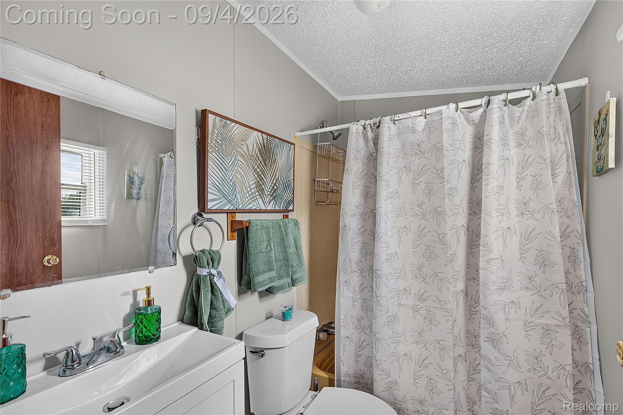 51074 Mott Road, Unit 200 Canton, MI 48188 - Photo 15 of 24 White vanity with an integrated rectangular sink and chrome faucet