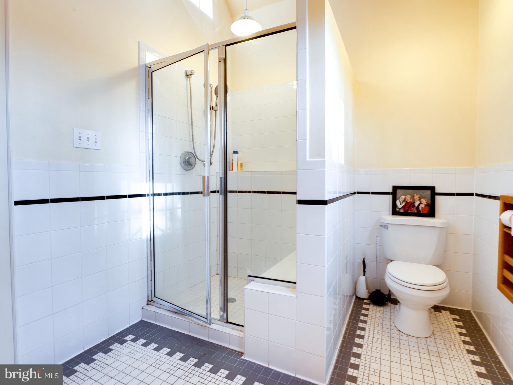 6306 Valley Road Bethesda, MD 20817 - Photo 40 of 74 a bathroom with a toilet and a shower