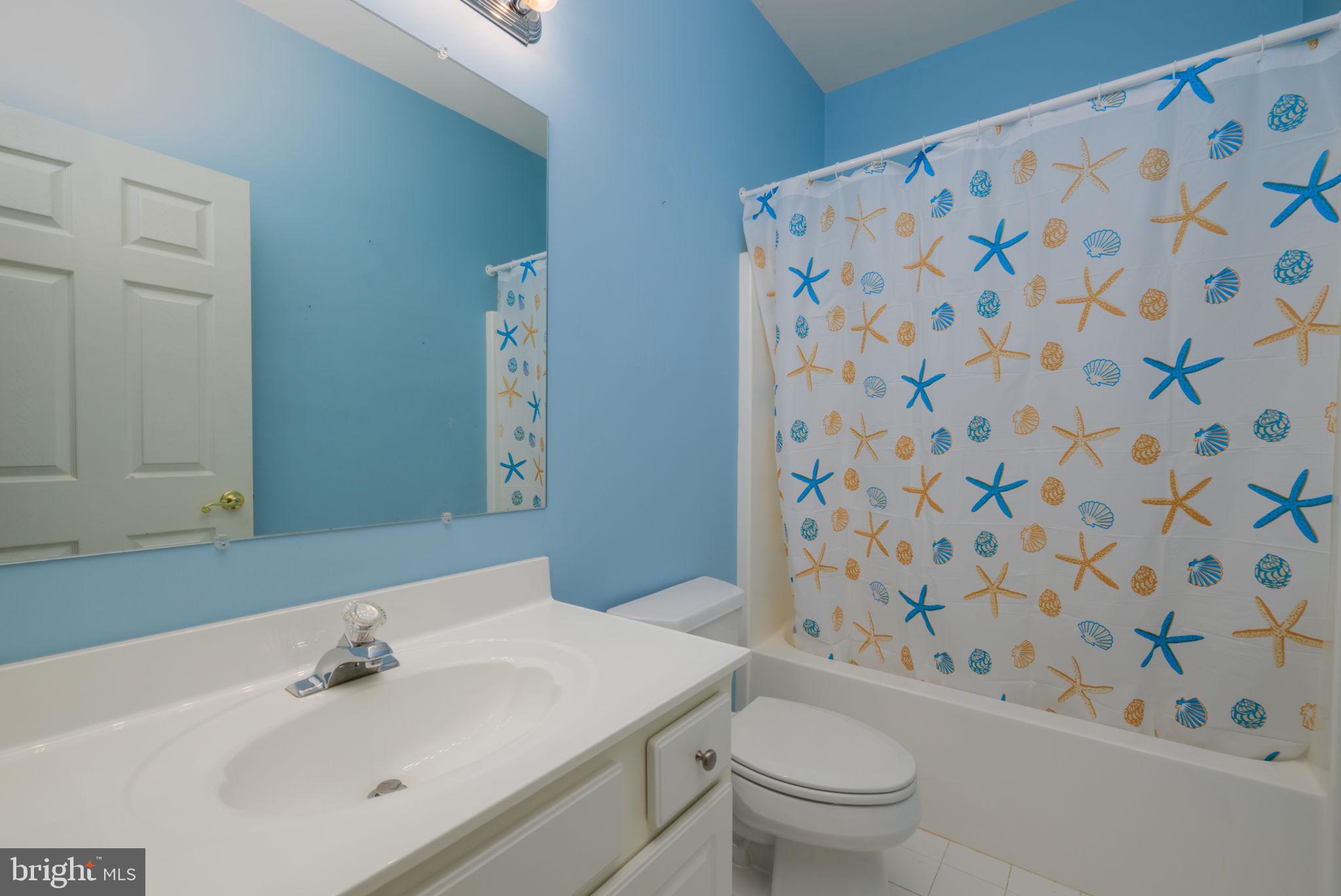 16841 Devon Road Lewes, DE 19958 - Photo 29 of 43 a bathroom with a sink toilet and shower