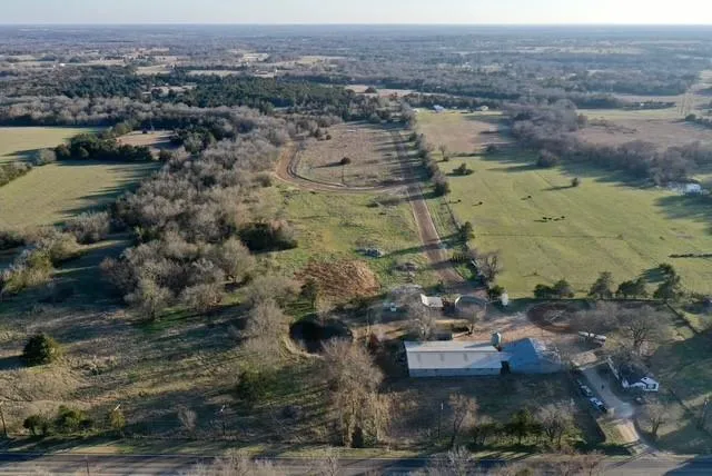 an aerial view of residential houses with outdoor space