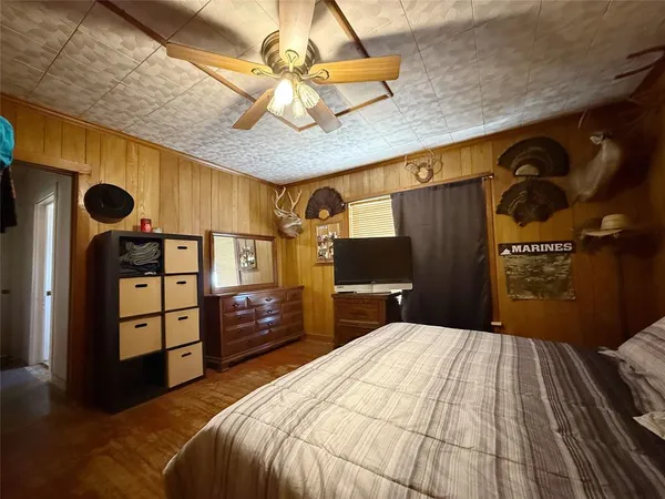 a view of a livingroom with furniture and a window