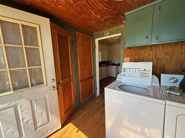 a bedroom with a bed furniture and a large window