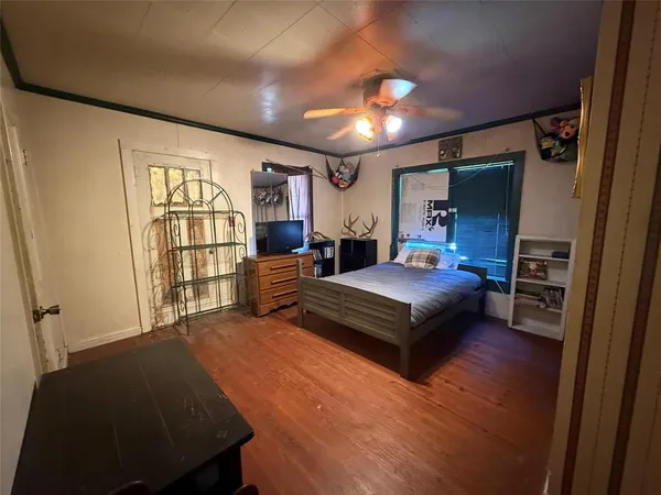 a kitchen with refrigerator and window