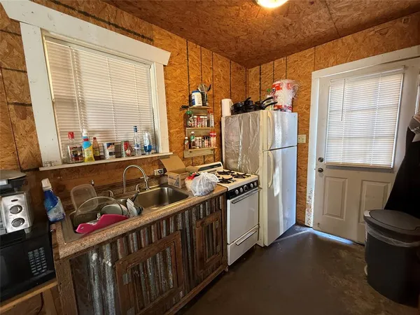 a bed room with a bed and a television