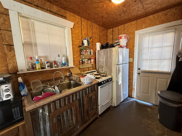 a bed room with a bed and a television