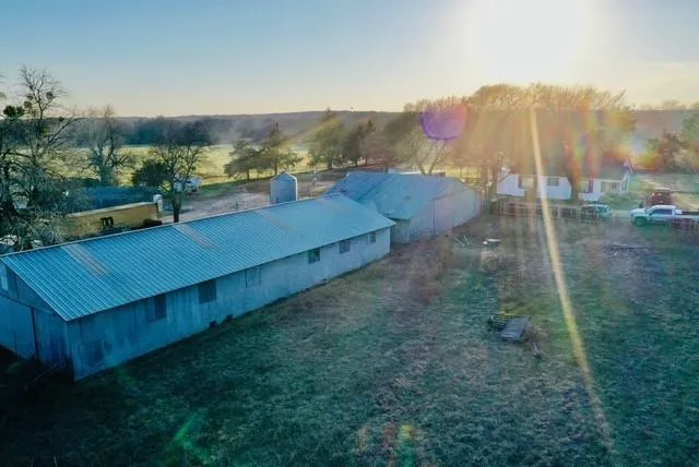 a view of a water pond with trees in the background