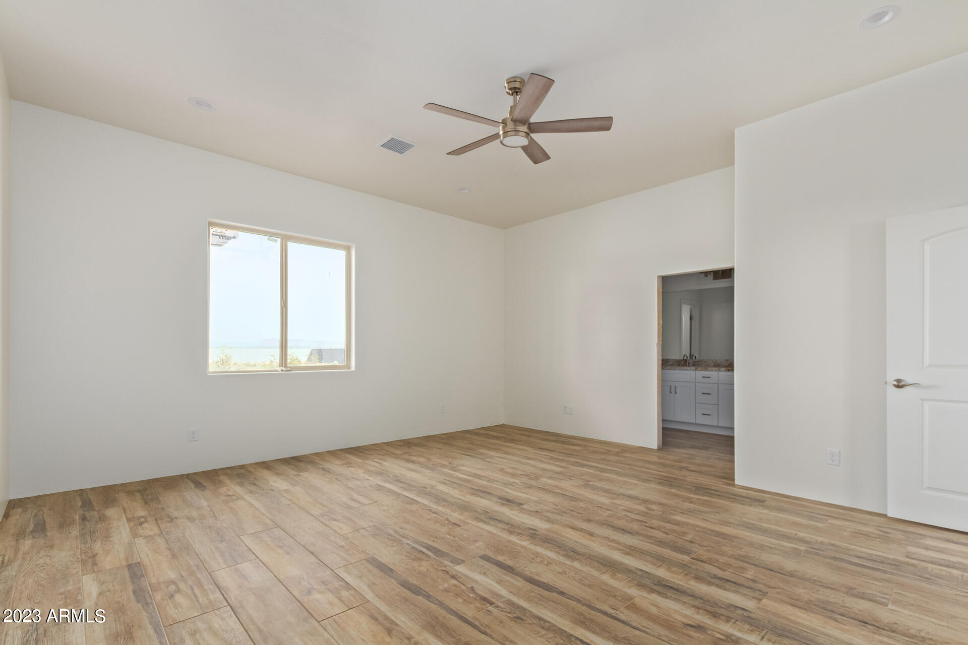 25202 West Montgomery Road Wittmann, AZ 85361 - Photo 22 of 50 Large primary bedroom