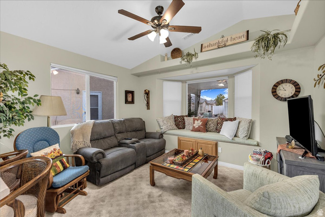 2990 East Riverside Drive, Unit 166 St. George, UT 84790 - Photo 8 of 22 Carpeted living area with lofted ceiling and a ceiling fan