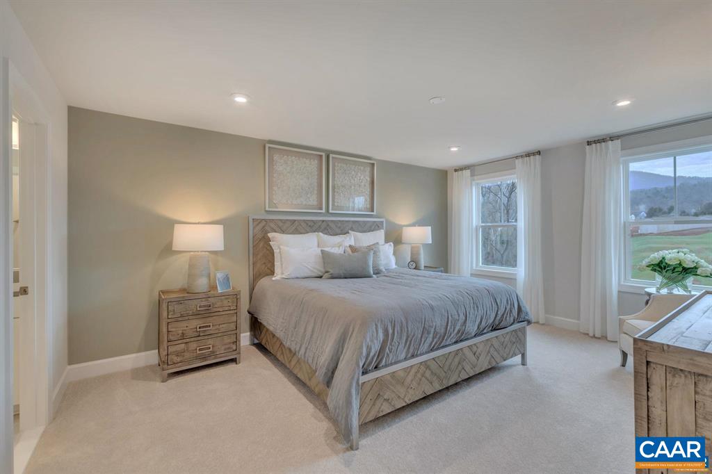 2837 Rambling Brook Lane Crozet, VA 22932 - Photo 16 of 24 a spacious bedroom with a bed and a couch