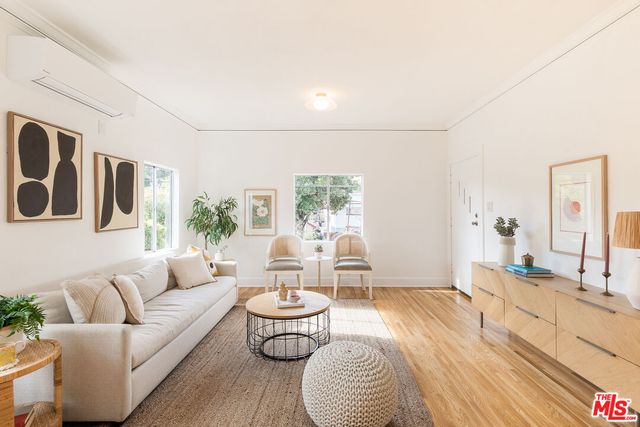 a living room with furniture and a table