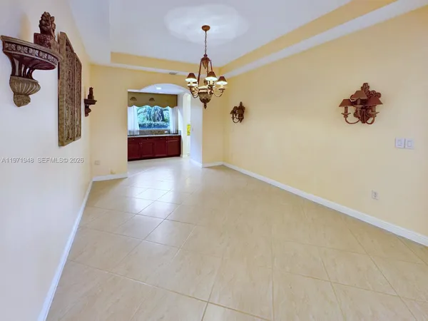 a kitchen with stainless steel appliances granite countertop a sink refrigerator and microwave