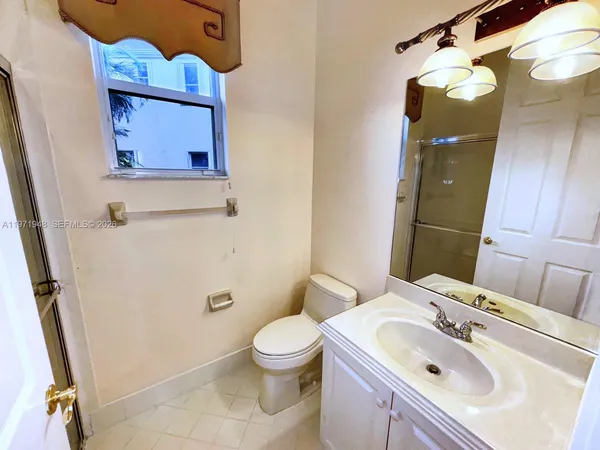 a view of a hallway view with wooden floor and staircase
