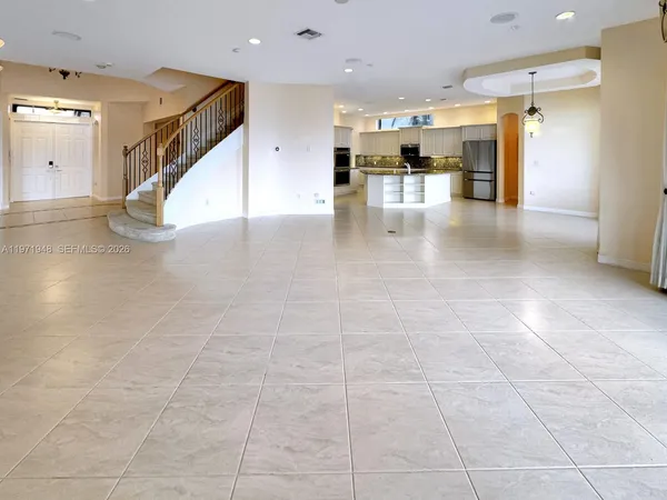 a bathroom with a sink a toilet a mirror and shower