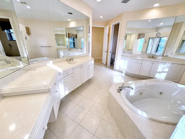 a view of swimming pool with a table and chair