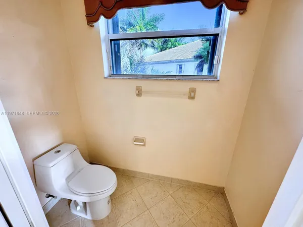 a view of a lake with a terrace with seating area