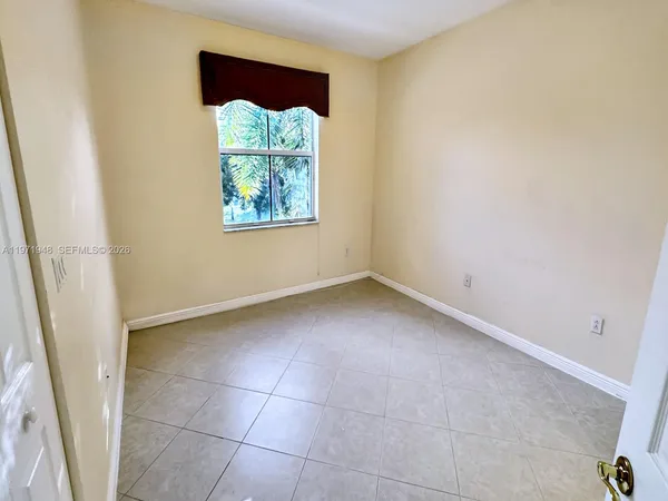 a view of a lake with houses in the back