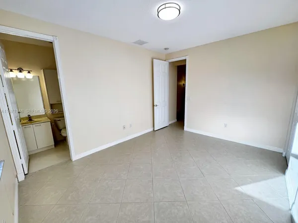 an aerial view of a house with a ocean view