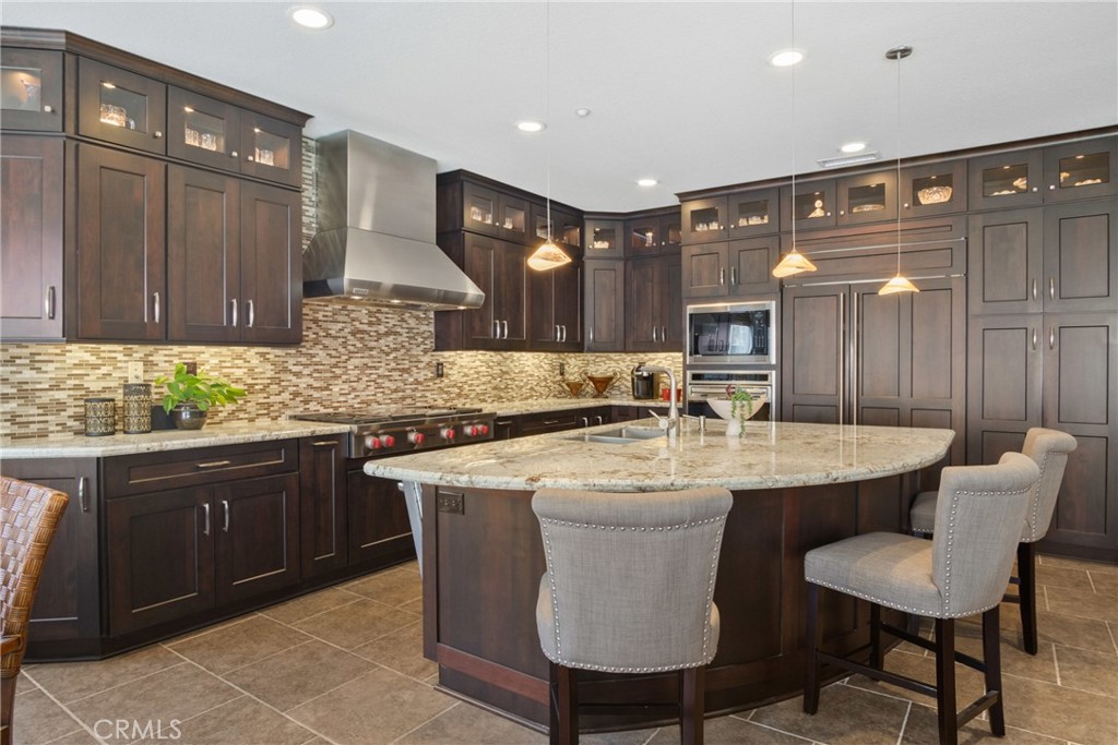 3837 Grandview Drive Brea, CA 92823 - Photo 24 of 72 a kitchen with center island table and chairs