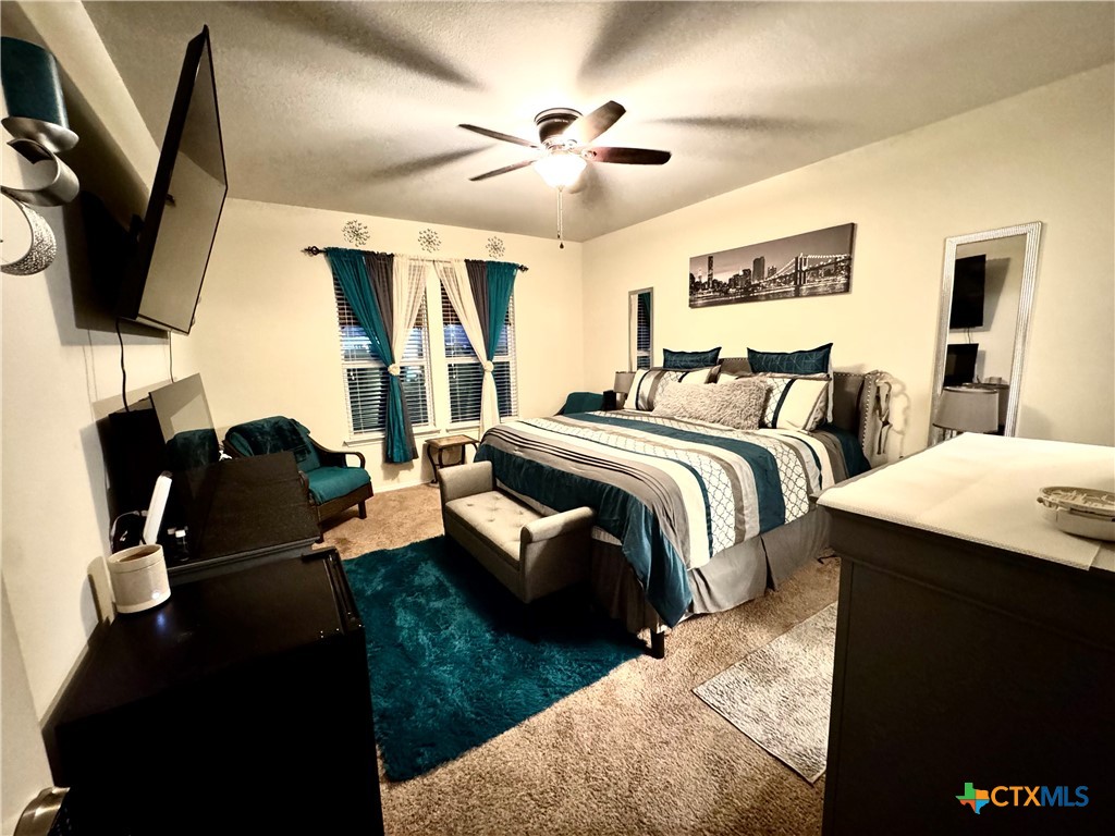 3101 Shawlands Road Killeen, TX 76542 - Photo 13 of 45 a spacious bedroom with two beds and a flat screen tv