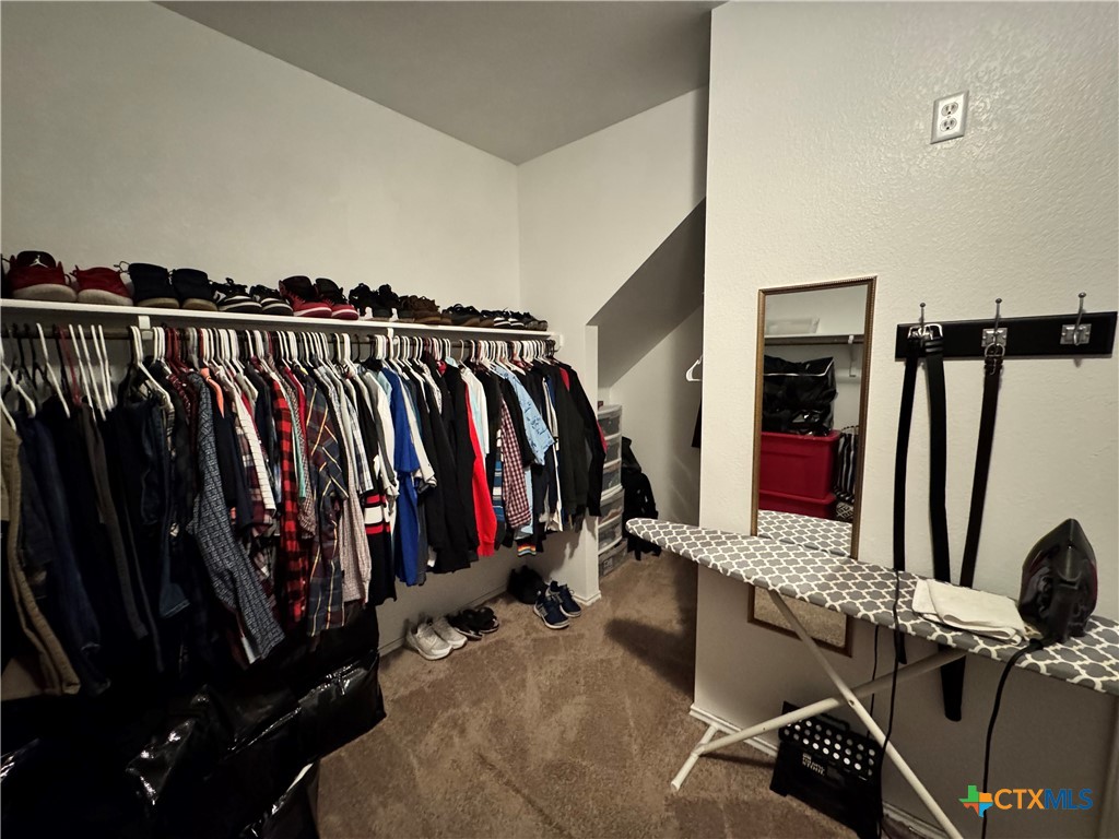 3101 Shawlands Road Killeen, TX 76542 - Photo 19 of 45 a view of walk in closet with clothes and shoes