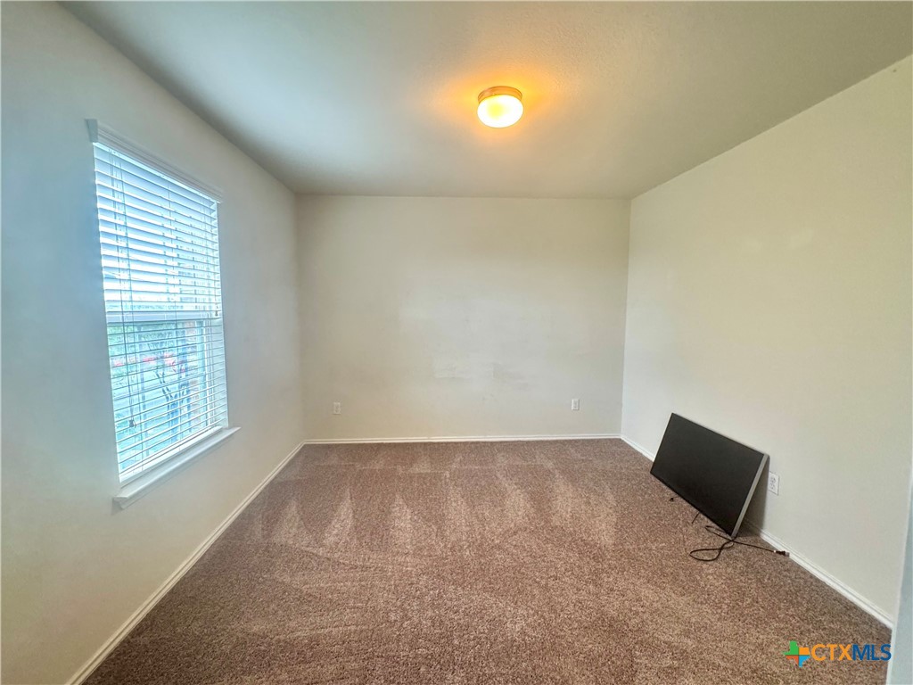 3101 Shawlands Road Killeen, TX 76542 - Photo 33 of 41 an empty room with windows and yard