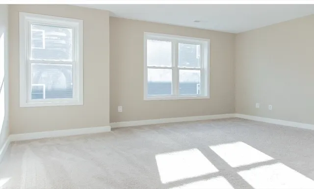 an empty room with windows