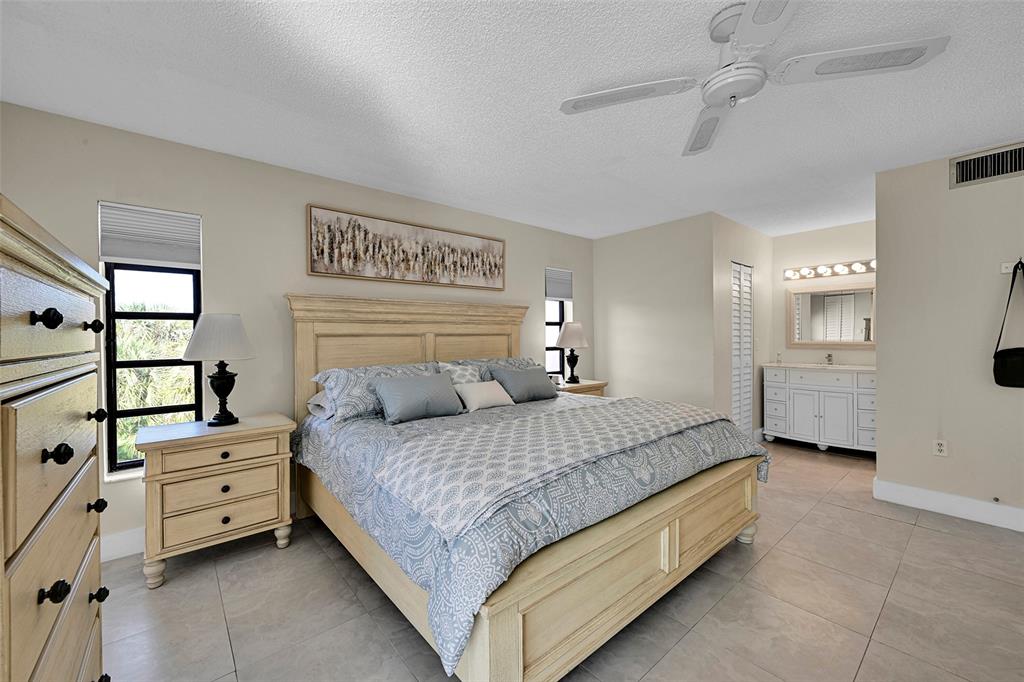 3591 Environ Boulevard, Unit A305 Lauderhill, FL 33319 - Photo 29 of 73 a bedroom with a bed and a window