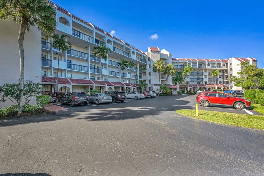 3591 Environ Boulevard, Unit A305 Lauderhill, FL 33319 - Photo 3 of 73 a building with sign board and yard in the back