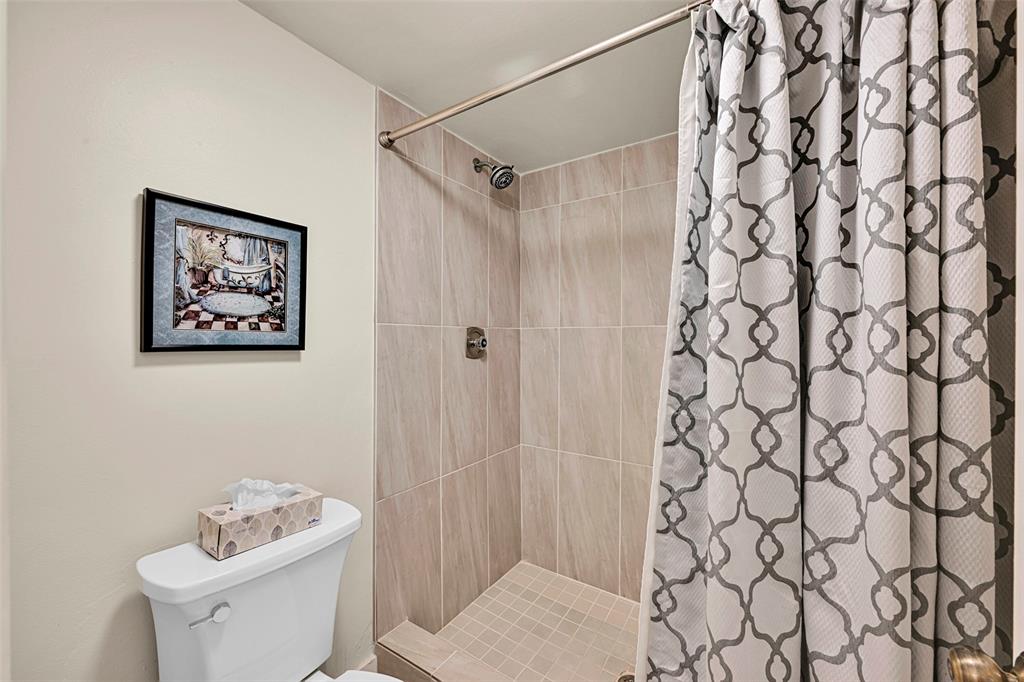 3591 Environ Boulevard, Unit A305 Lauderhill, FL 33319 - Photo 33 of 73 a bathroom with a shower curtain and a sink