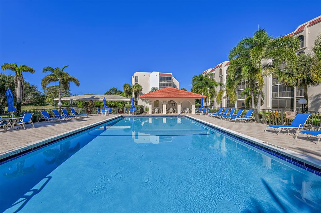 3591 Environ Boulevard, Unit A305 Lauderhill, FL 33319 - Photo 40 of 73 a swimming pool view with a outdoor seating