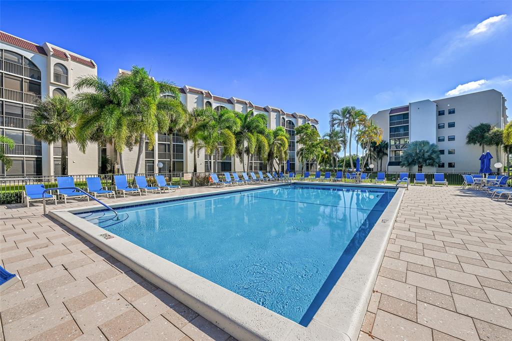 3591 Environ Boulevard, Unit A305 Lauderhill, FL 33319 - Photo 41 of 73 a view of swimming pool with outdoor seating and plants
