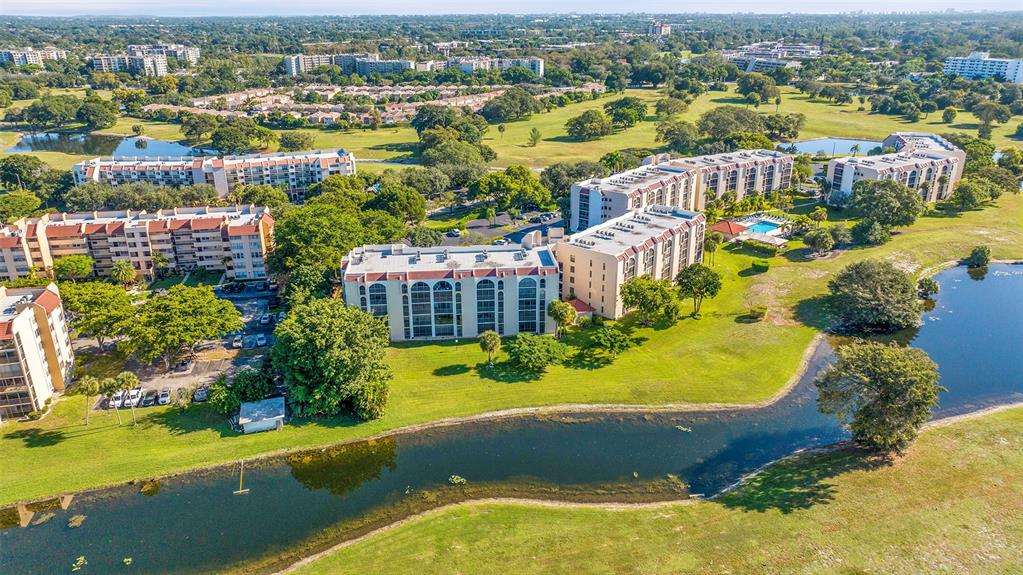 3591 Environ Boulevard, Unit A305 Lauderhill, FL 33319 - Photo 63 of 73 an aerial view of residential houses with outdoor space and swimming pool