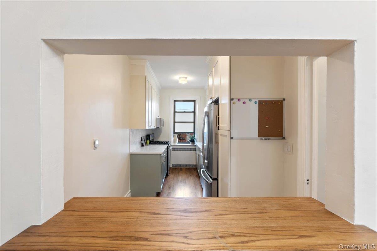 167 Centre Avenue, Unit 3E New Rochelle, NY 10805 - Photo 7 of 15 a view of kitchen and hallway with wooden floor