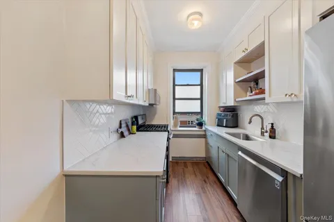a view of a kitchen from the hallway