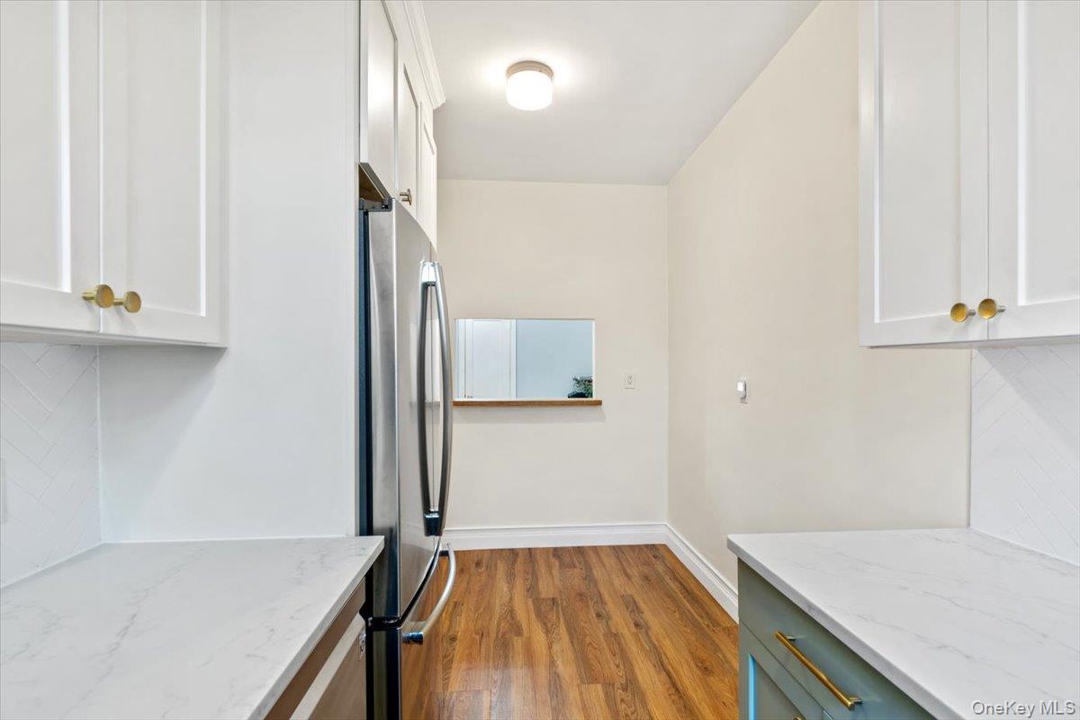 167 Centre Avenue, Unit 3E New Rochelle, NY 10805 - Photo 9 of 15 a view of a kitchen from the hallway