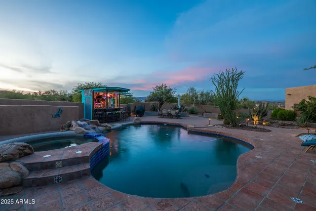 a view of a chairs and table in patio